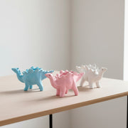 Maceta de cerámica en forma de dinosaurio con picos