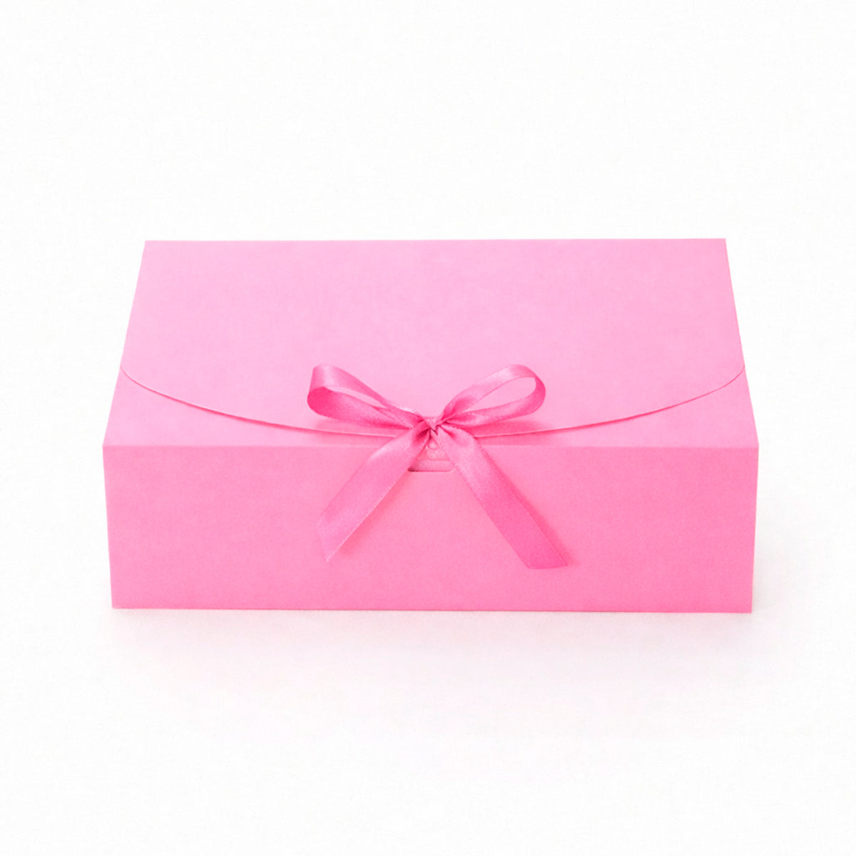 caja de cartón rosa con liston para regalo