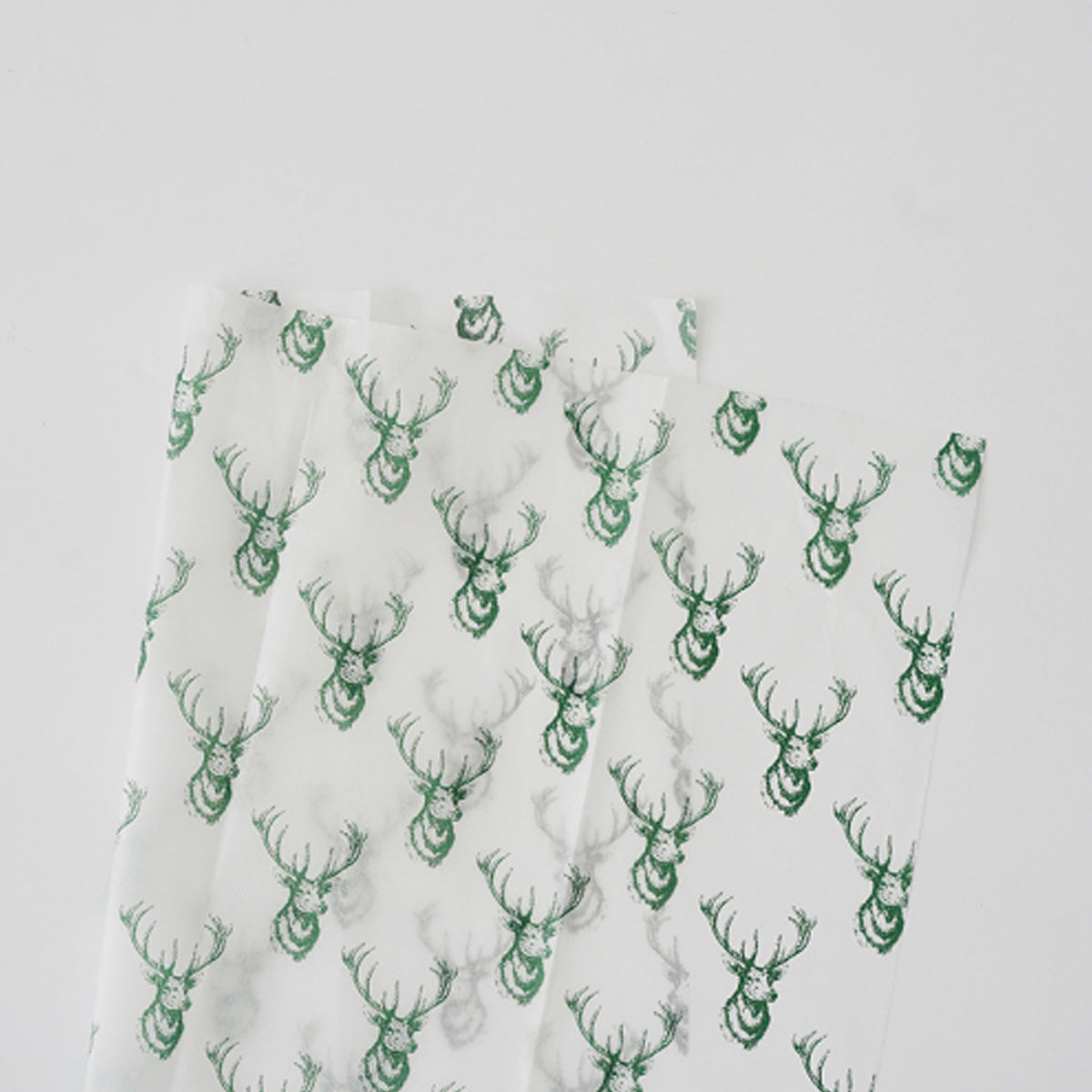 Papel tipo seda navideño paquete de 10 pliegos con diseños variados para arreglos florales, ramos y flores.