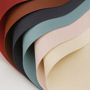 Papel coreano tipo pellón en colores vino, lima, rosa, blanco, naranja, negro, amarillo y beige. Insumo para floreria, ramos y envolver flores, de alta calidad.