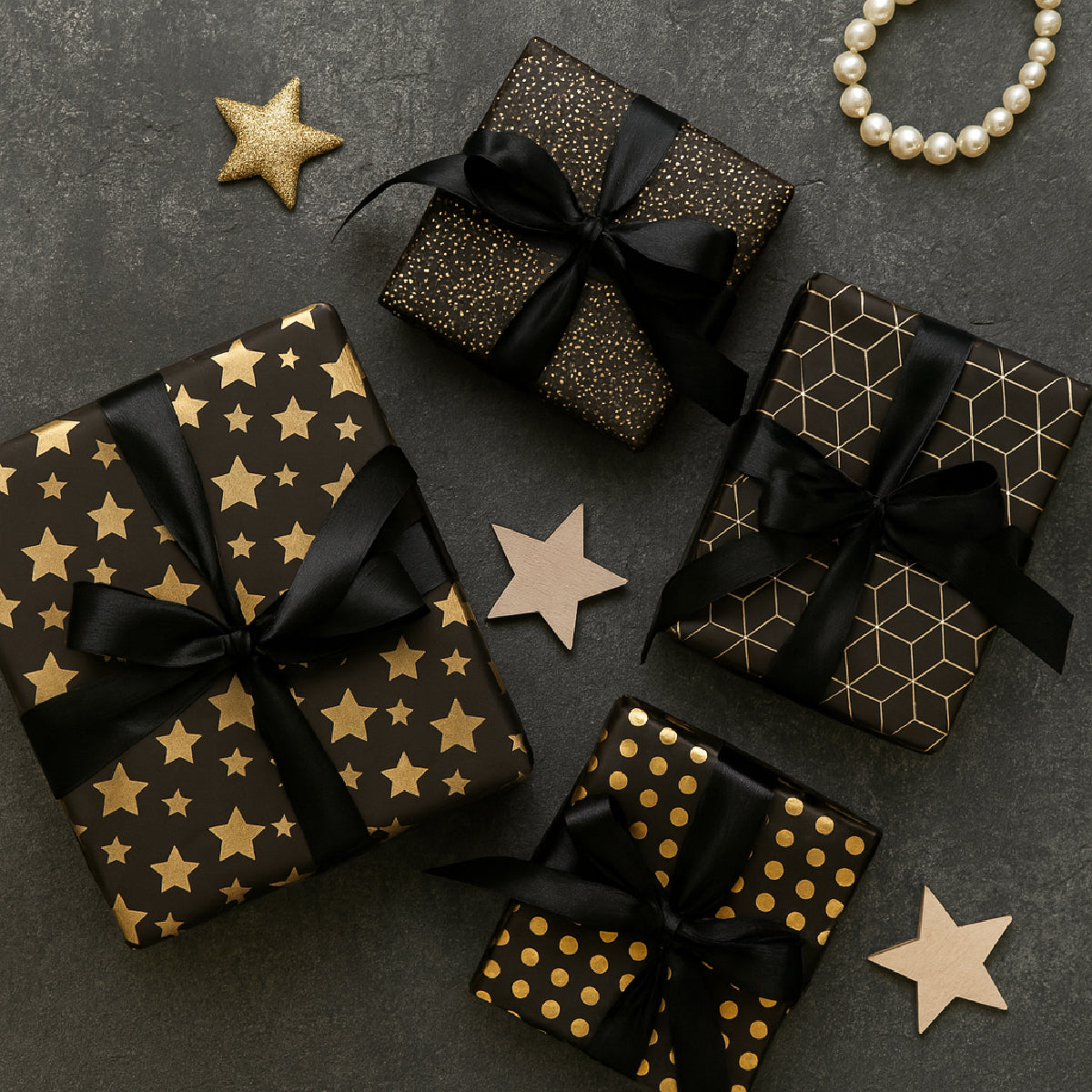 Papel de regalo negro con dorado premium 20 pliegos